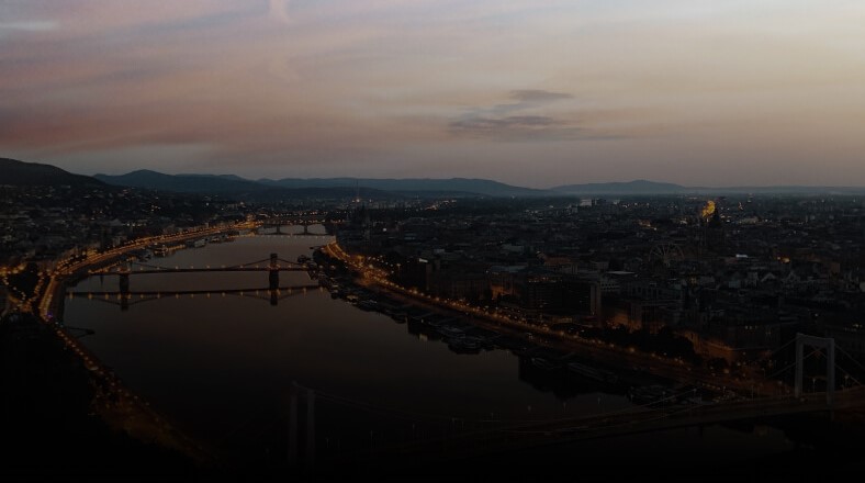 Cityscape at sunset with bridge